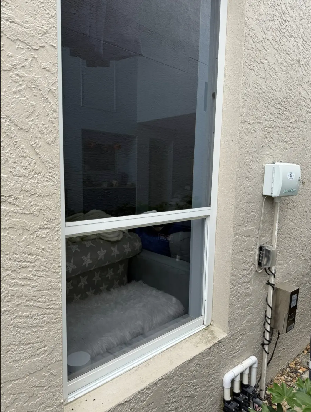 Window with organic buildup and film, after window cleaning